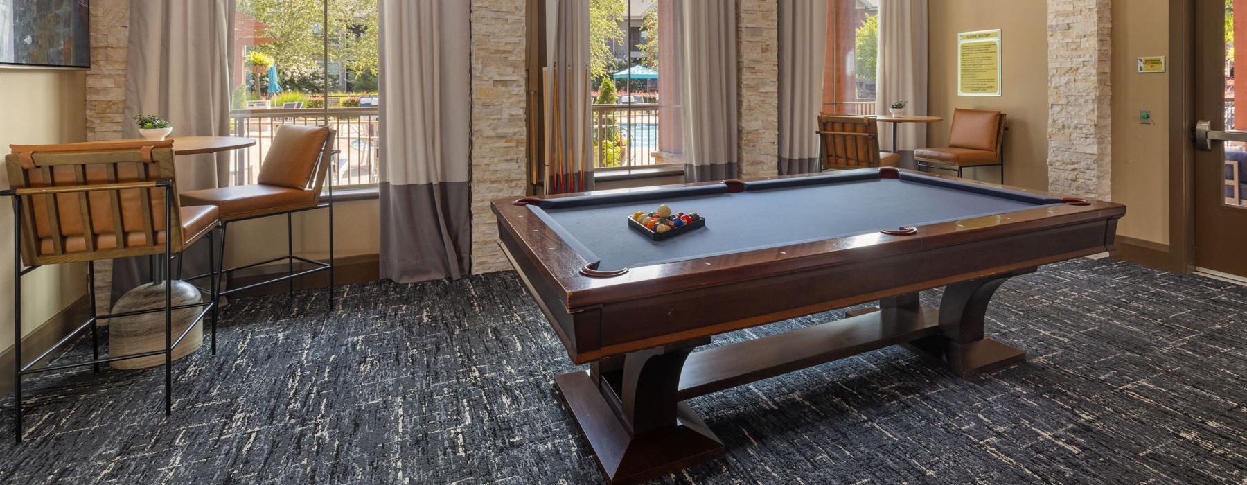 Beautiful clubroom with lounge seating and billiards