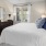 Bedroom with natural lighting and high ceilings